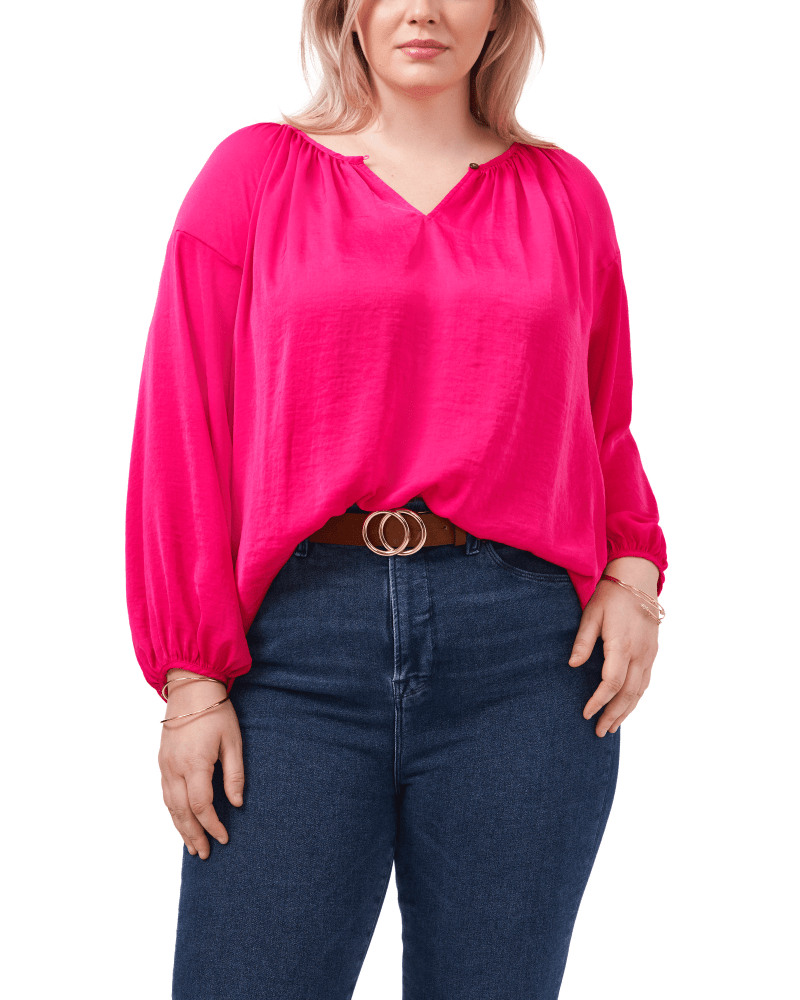 Front of a model wearing a size 1X Aria Peasant Blouse in PINK SHOCK by Vince Camuto. | dia_product_style_image_id:261488